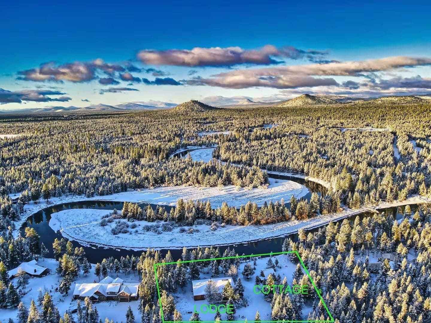 Aerial view of the Deschutes River looping through snow-dusted forest, with the estate boundary and the Lodge and Cottage marked
